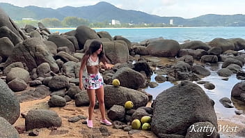 Wet Naked girl found a coconut on a public beach and poured the juice over her body