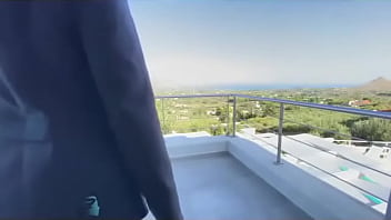 Outdoor sexy real estate business woman used on a public balcony