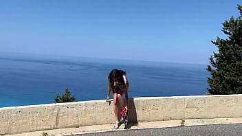 Pee-panties Shameless girl pissing standing on the background of the sea